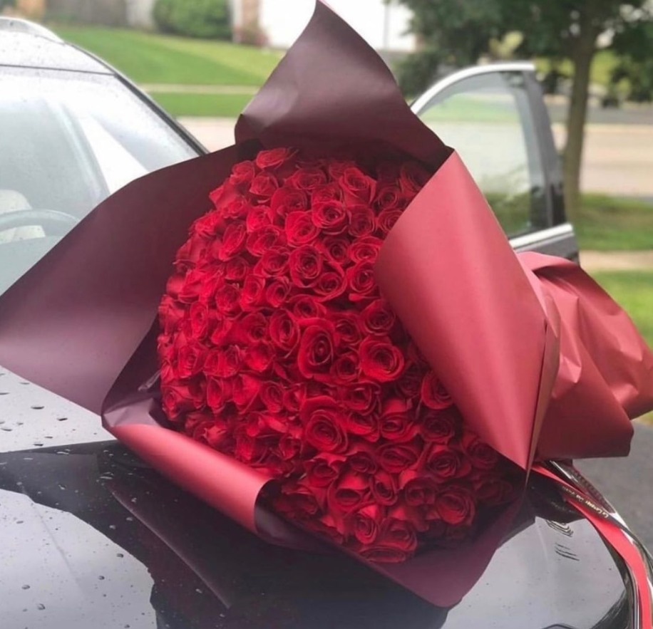 100 Red Roses Wpapped on Black Paper Bouquet