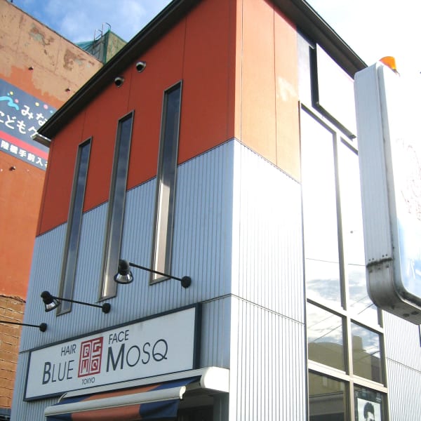 松山市美容室、下がシルバー上がオレンジの建物|ブルーモスクTOKYO